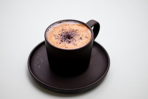 Free Black Cup of Hot Chocolate on a Saucer Stock Photo