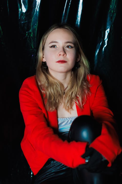 Young Woman in Red Blazer and Black Pants