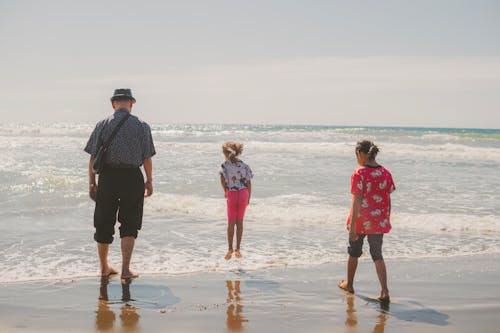 Father with Daughters Together at Beach