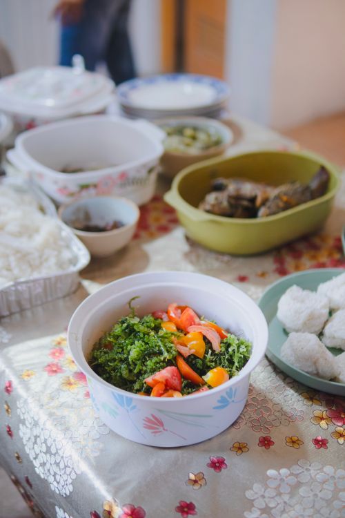 Free A vibrant salad and various dishes arranged on a decorated table indoors. Stock Photo