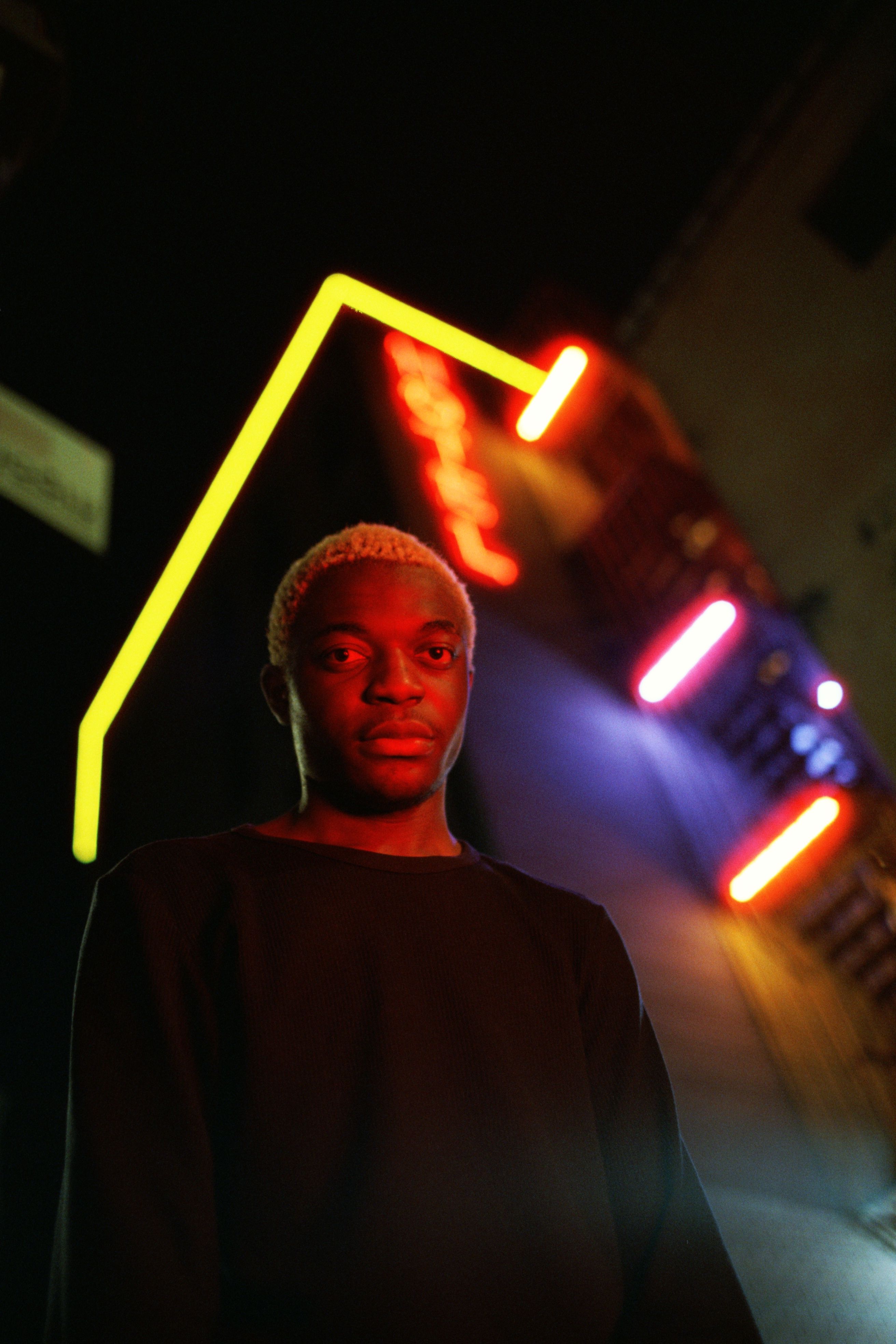A man standing in front of neon lights · Free Stock Photo