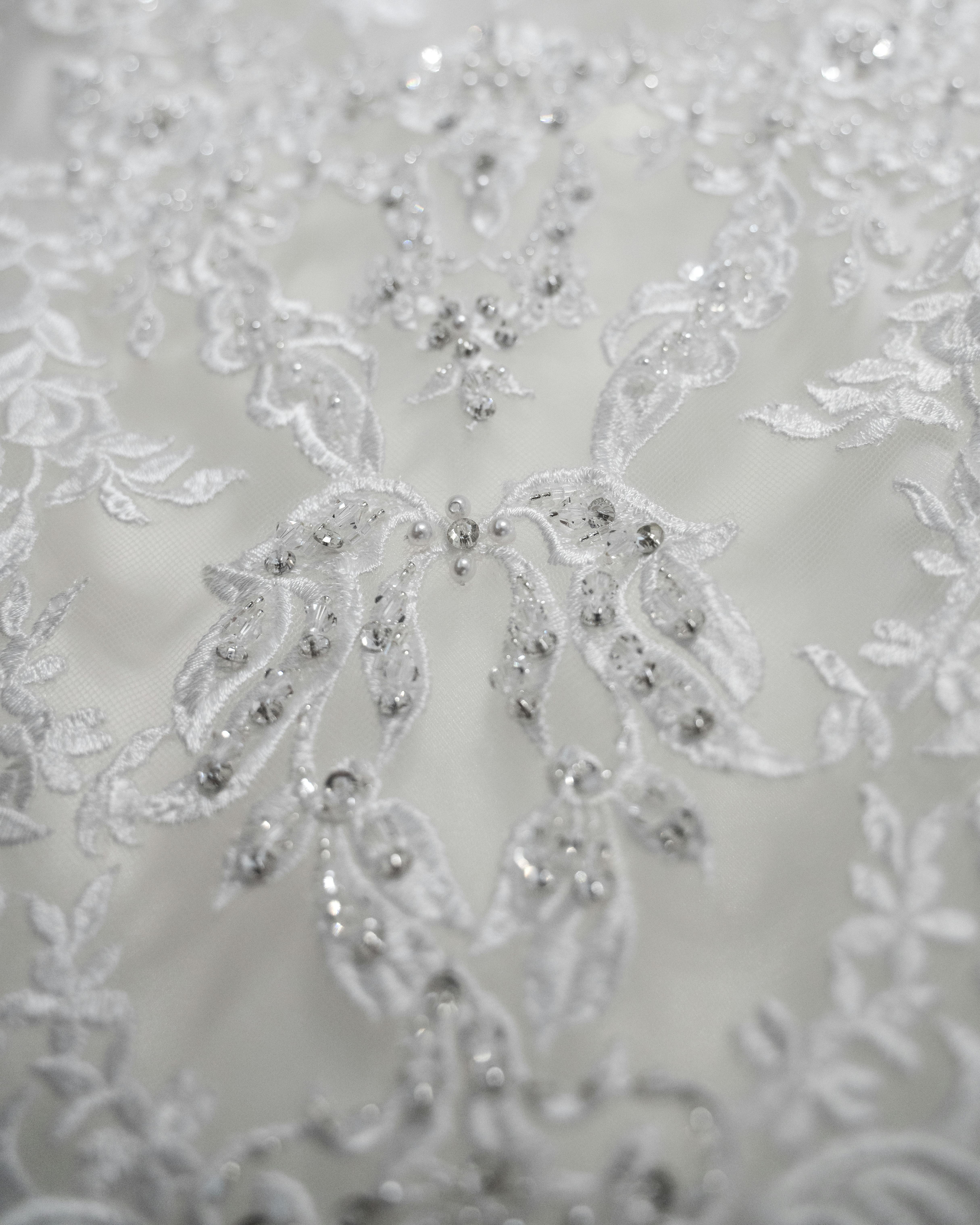 close up of embroidery on a wedding dress