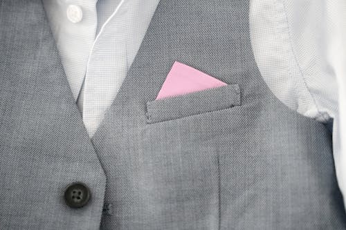 Closeup of a Gray West with a Pink Pocket Square