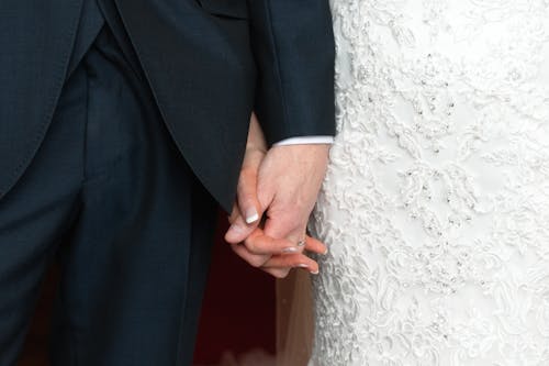 Bride And Groom Holding Hands