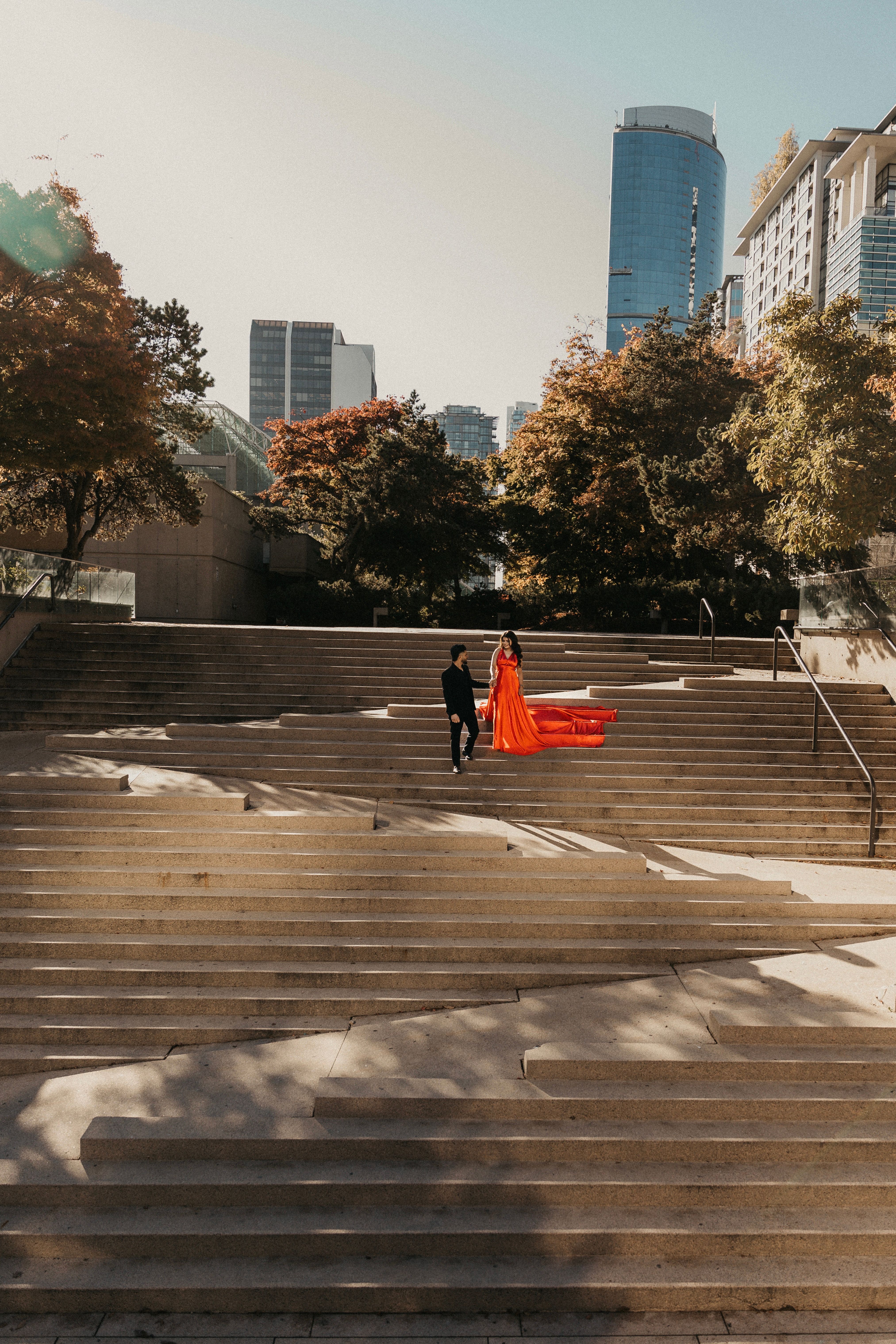Elegant Man and Woman Walking on the Steps in City · Free Stock Photo