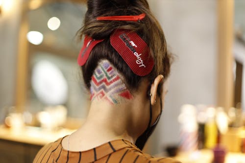 A woman with a red and white hairband on her head