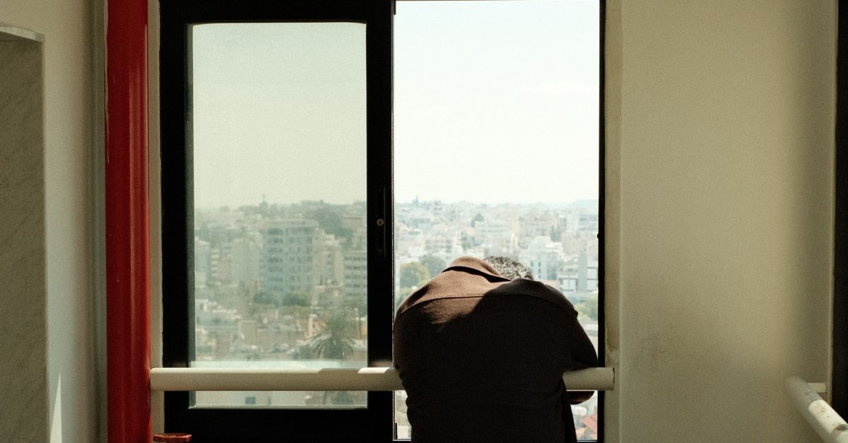 Person Looking through Open Window · Free Stock Photo