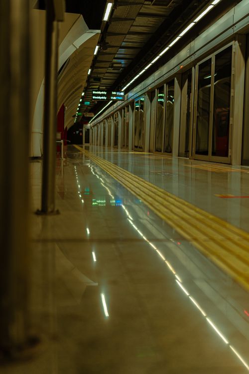 Free A sleek İstanbul subway station platform with reflective floors at night. Stock Photo