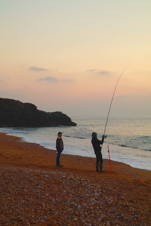 Free stock photo of beach life, beach sunset, fisherman