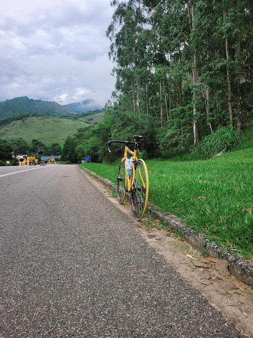 Yellow Racing Bike on Road Side