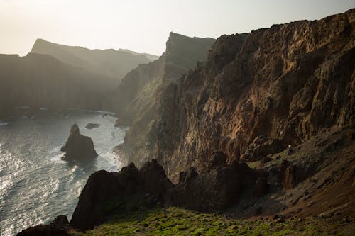 A view of the ocean and cliffs from a cliff