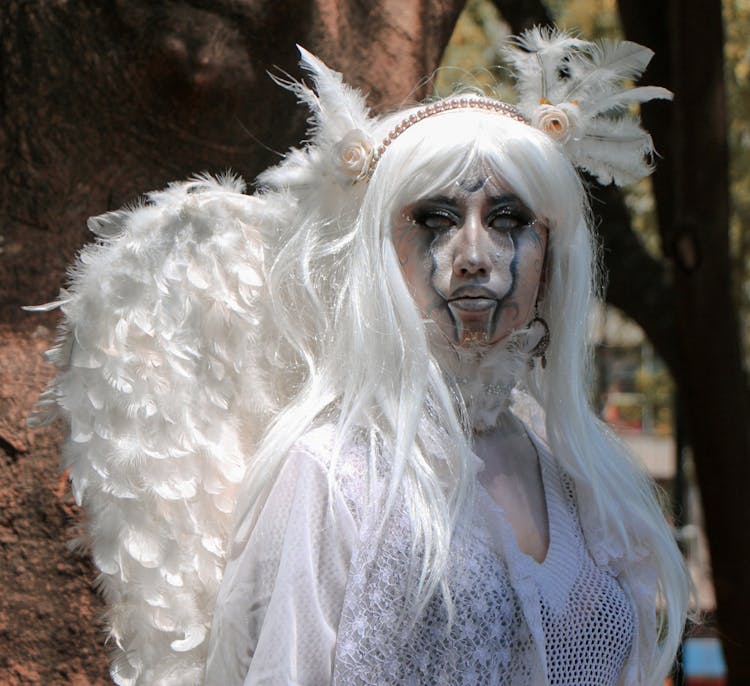 Portrait Of Woman Wearing Halloween Angel Costume 