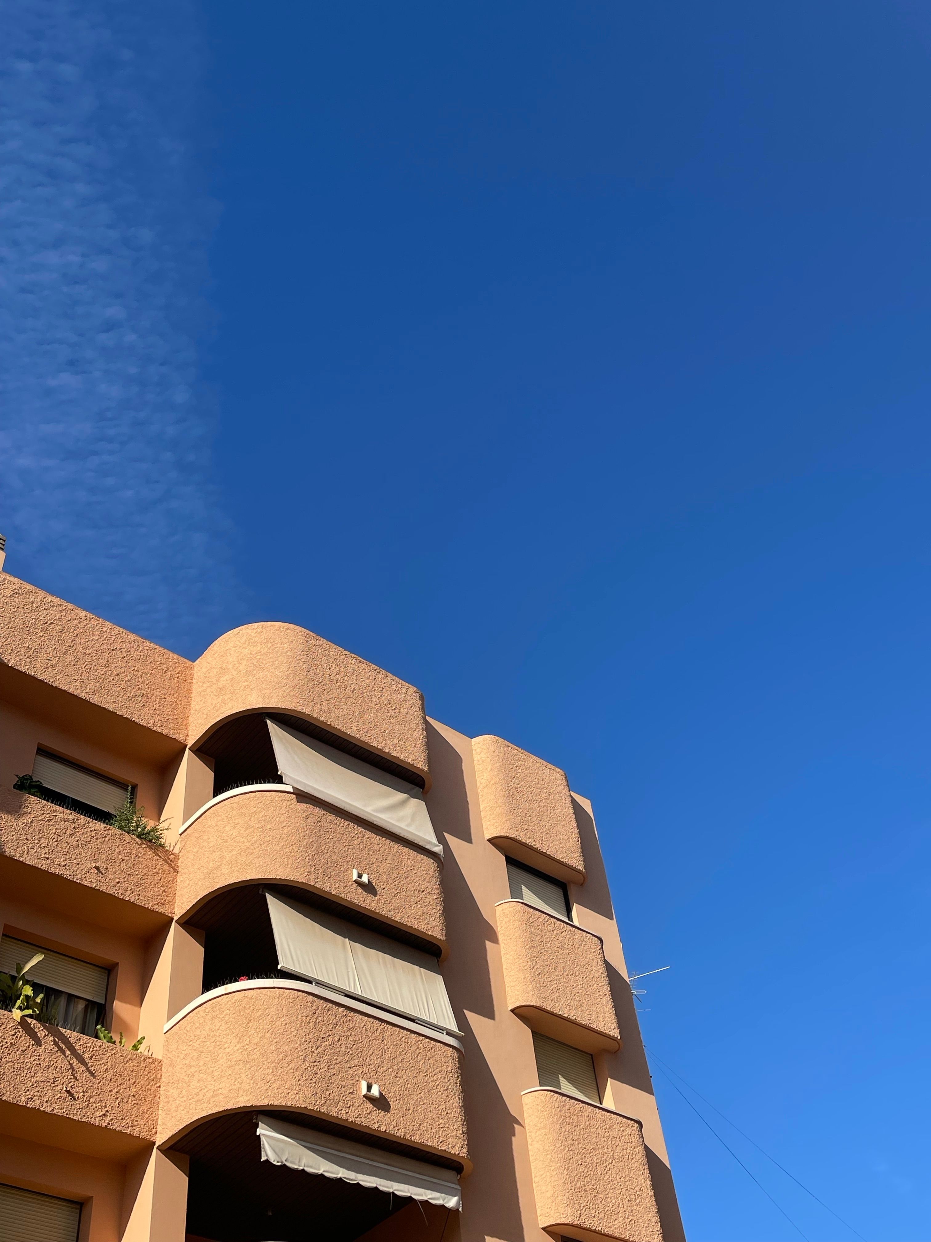 Low Angle Shot of an Apartment Building in City under Blue Sky · Free ...