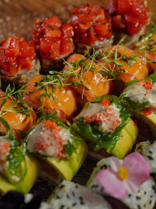 Free A colorful close-up of gourmet sushi rolls with fresh ingredients, perfect for food enthusiasts. Stock Photo