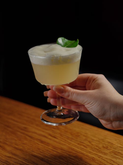 Close-up of Woman Holding a Cocktail 