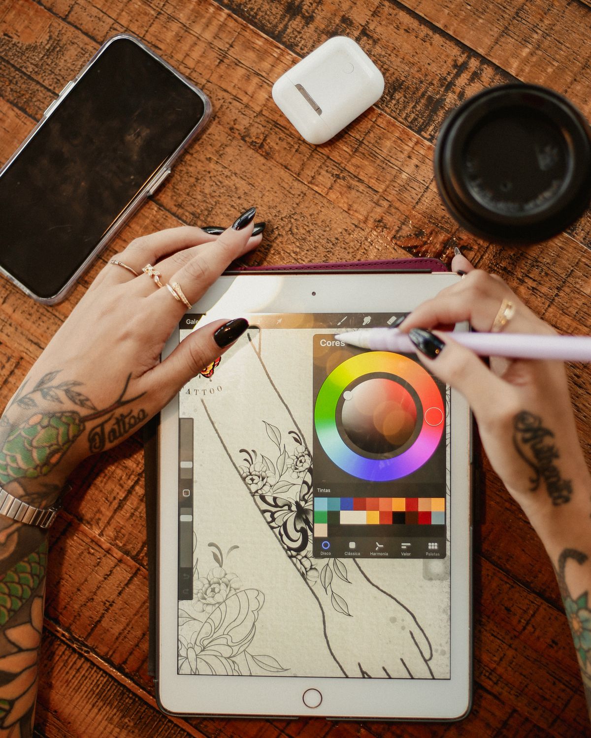 Artist Drawing Tattoos on Tablet · Free Stock Photo