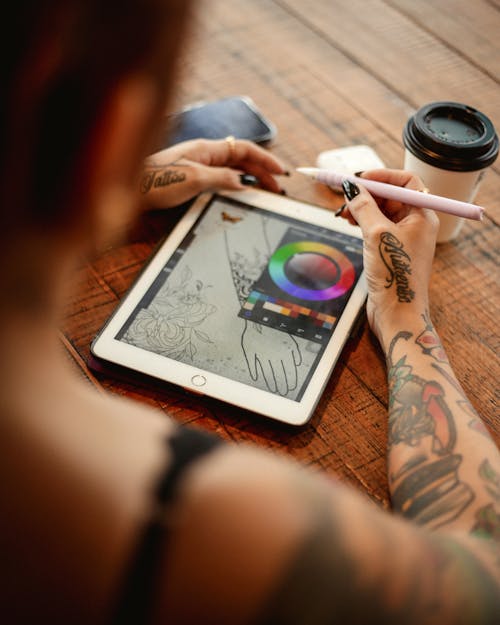 Woman Drawing on Tablet