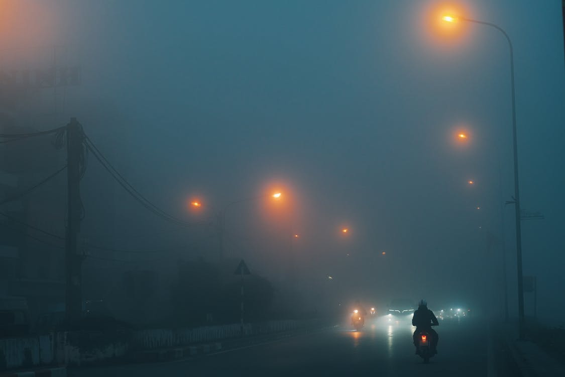 Street Lamps Lights over Street under Fog at Night