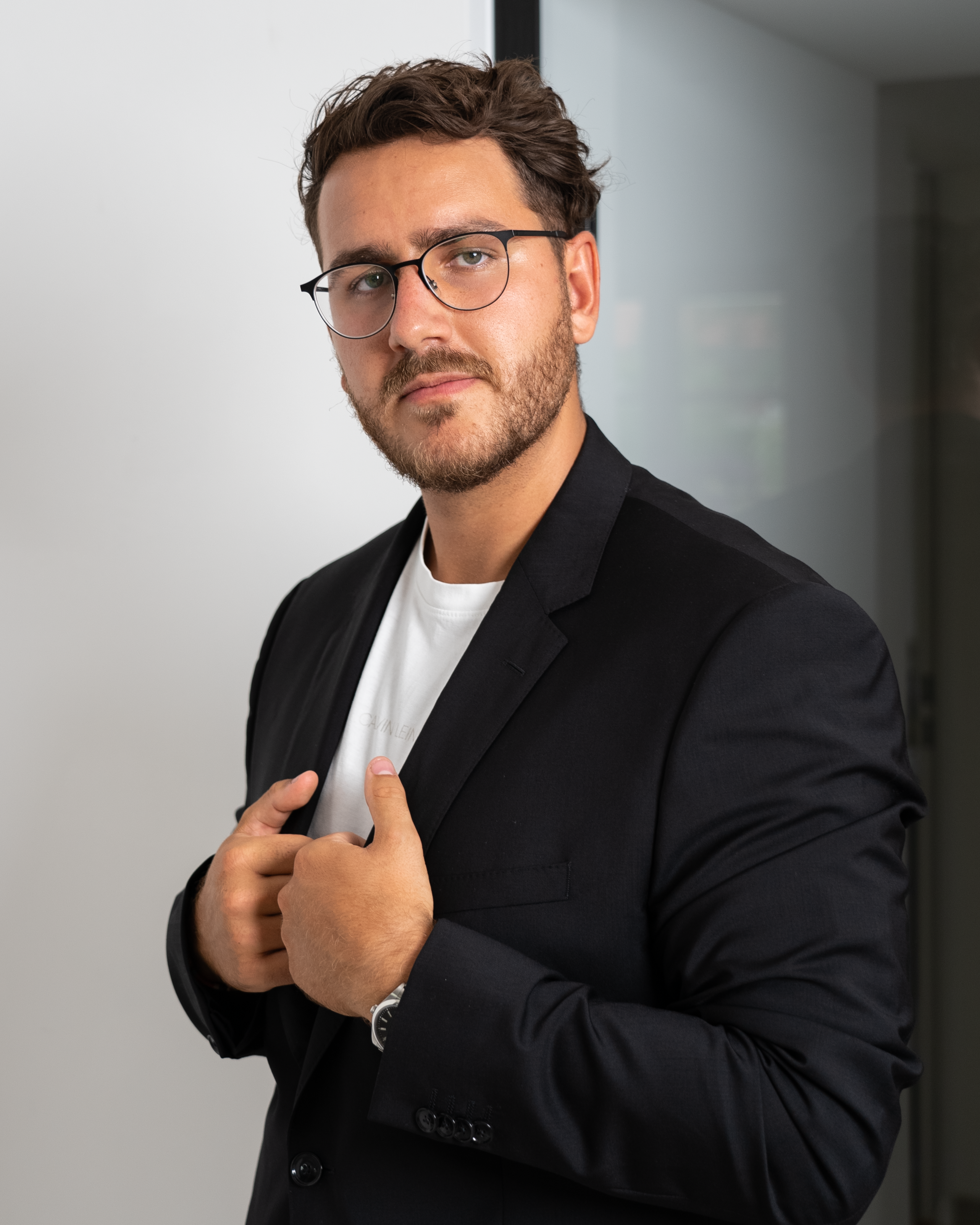 Elegant Man in Suit and Glasses  Free Stock Photo