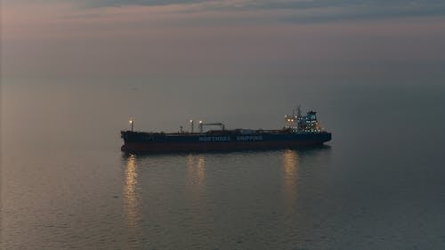 View of an Oil Tanker on a Sea at Sunset