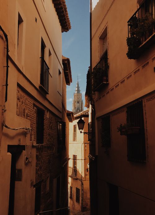 Free Explore the historic architecture of Toledo with a view of the city's iconic cathedral spire. Stock Photo