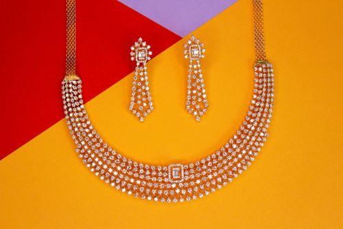 Free Close-up of luxurious diamond necklace and earrings set against a vibrant background, showcasing elegance and glamour. Stock Photo