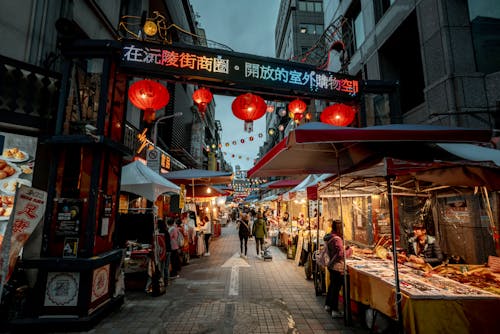 A street with many stalls and lanterns