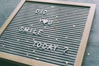 Letter board with motivational text 'Did you smile today?' surrounded by colorful confetti.