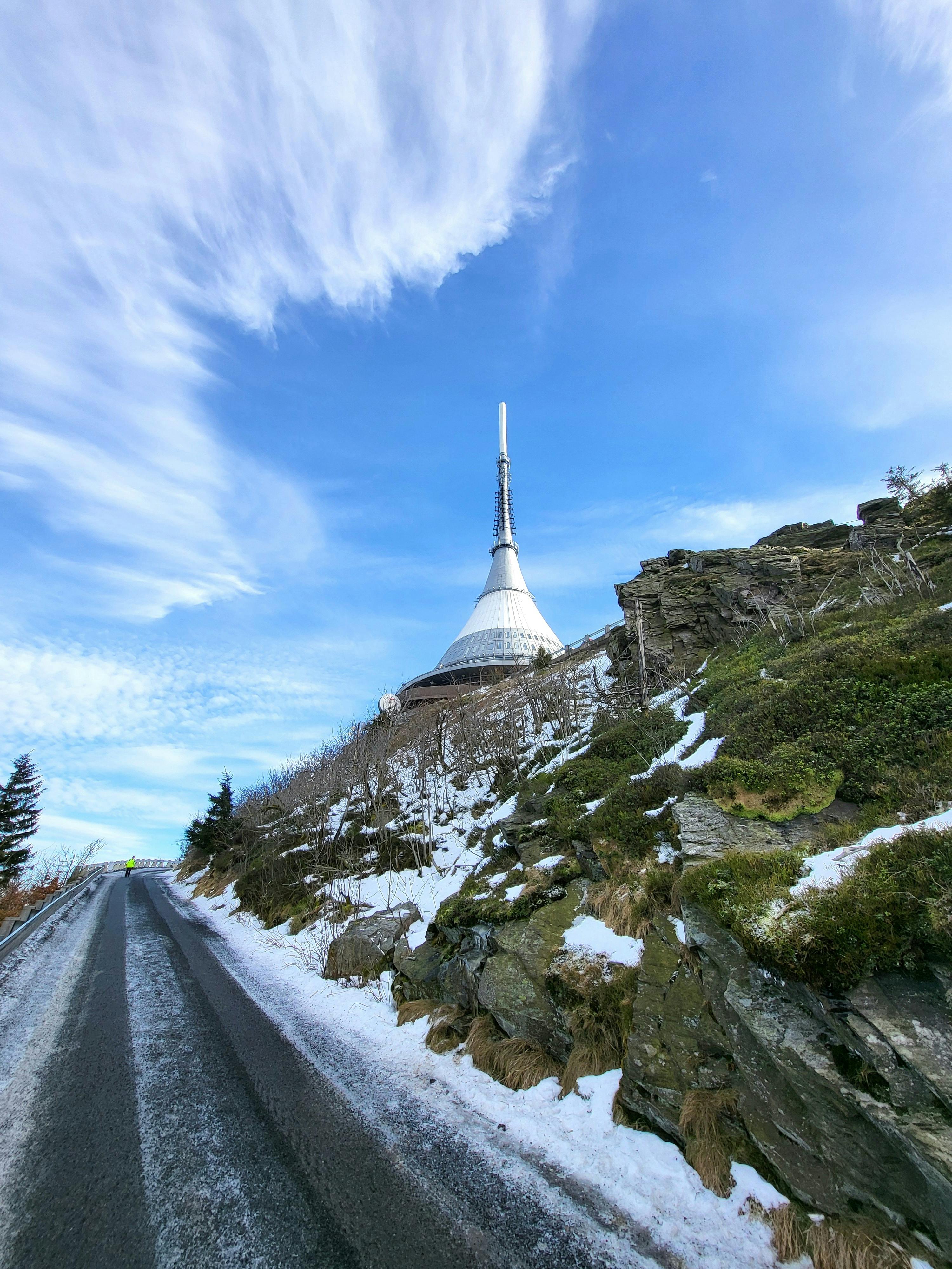 Ještěd Tower hyperboloid structure at sunset on mountain peak near Liberec Czech Republic with dramatic sky