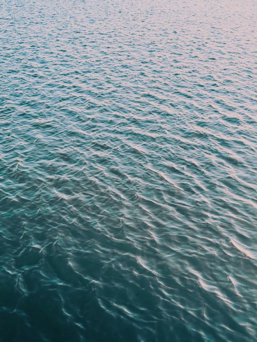 Free Calm ocean waves under clear sky at Norderney, Germany's serene beach Stock Photo