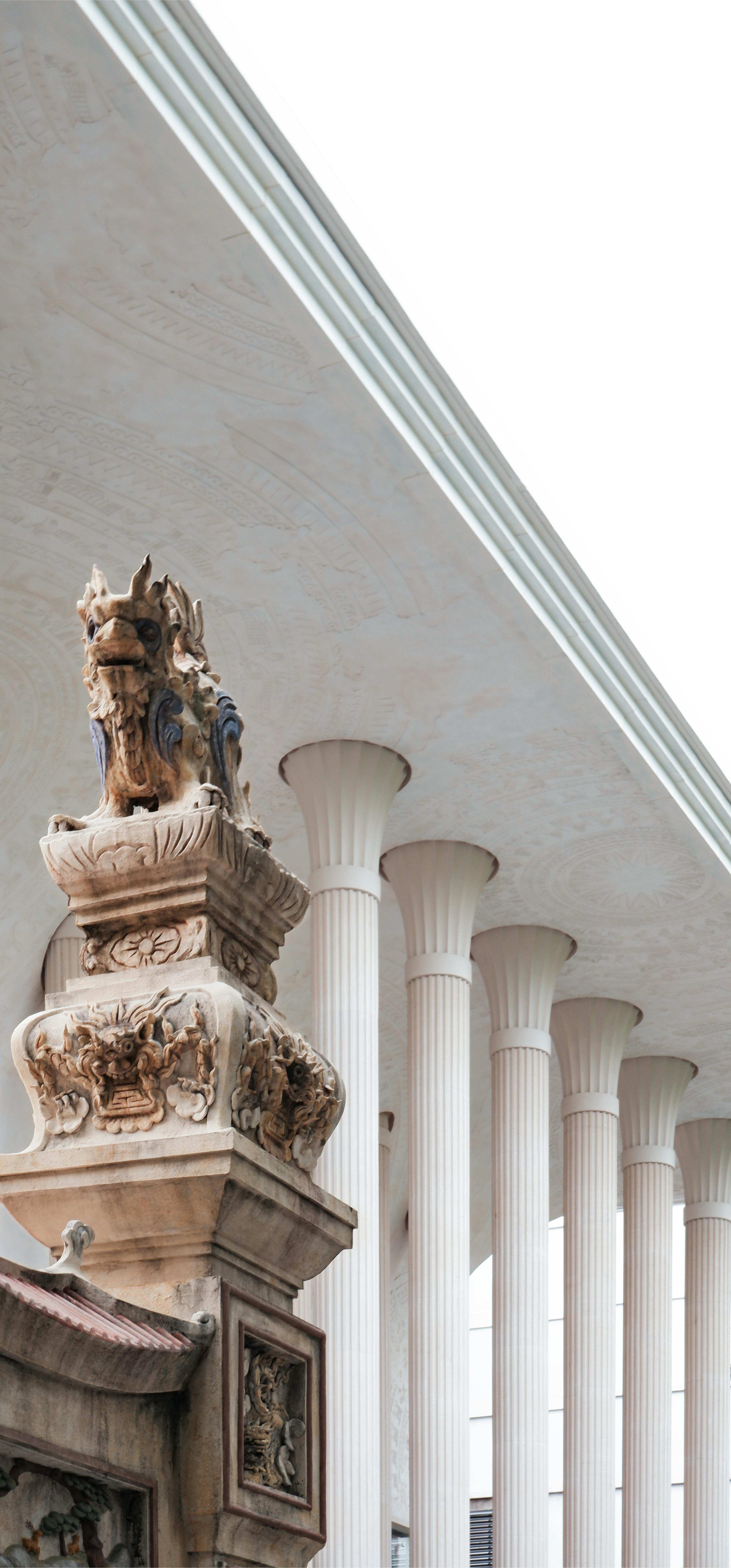 Close-up of ornate columns and sculptural decorations in a historical architectural setting.