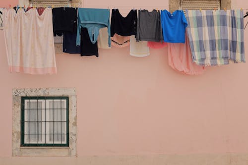 Clothes Hanging by House Wall