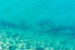 Clear turquoise ocean with ripples — photo by Jan van der Wolf on Pexels