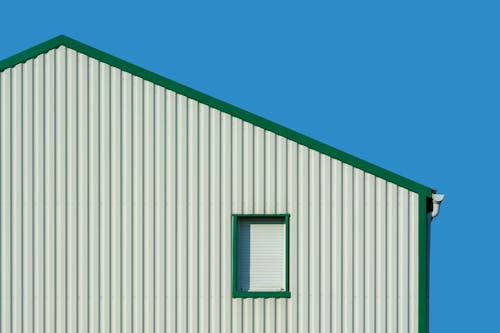 Gratis stockfoto met blauwe lucht, buitenkant van het gebouw, detailopname