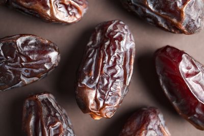 Bowl of dates and other whole food ingredients on a kitchen counter