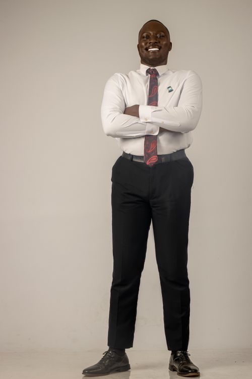 Free Smiling businessman standing confidently in white shirt and tie. Stock Photo