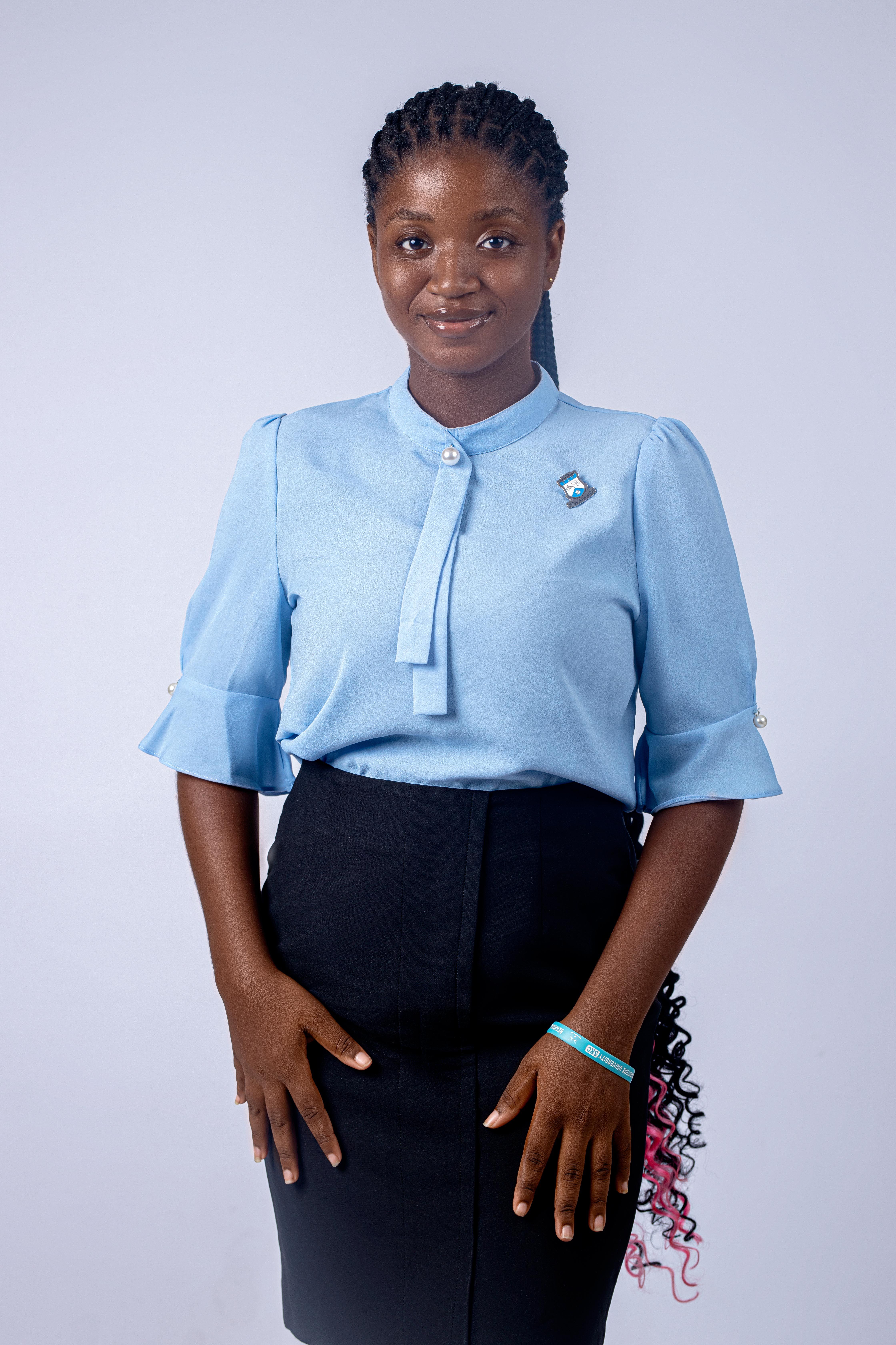 Portrait of a young woman wearing a blue blouse and black skirt, exuding elegance and confidence.