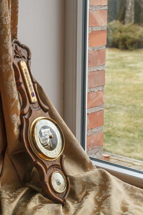 Free Wooden Old-fashioned Barometer on Window Sill Stock Photo