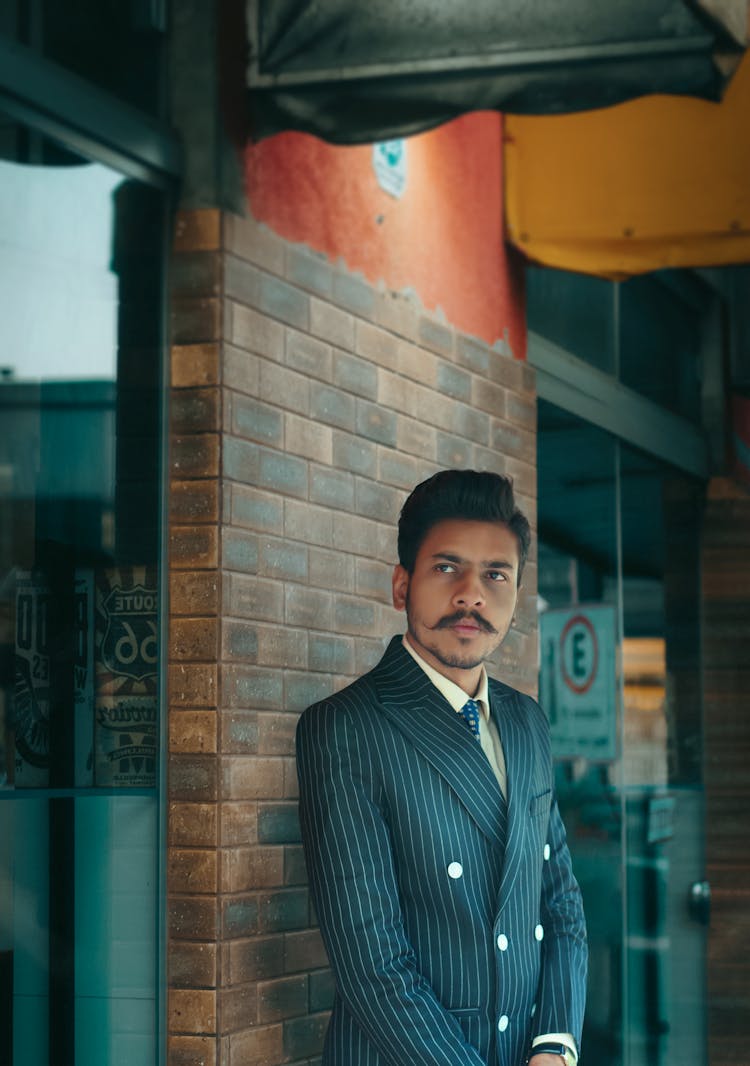 Man In Black Suit Standing