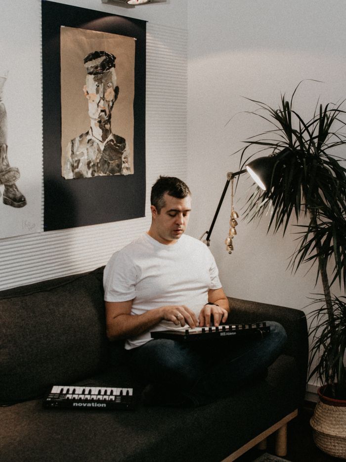 A person composing music with a keyboard at home — photo by Dmitry Rodionov on Pexels
