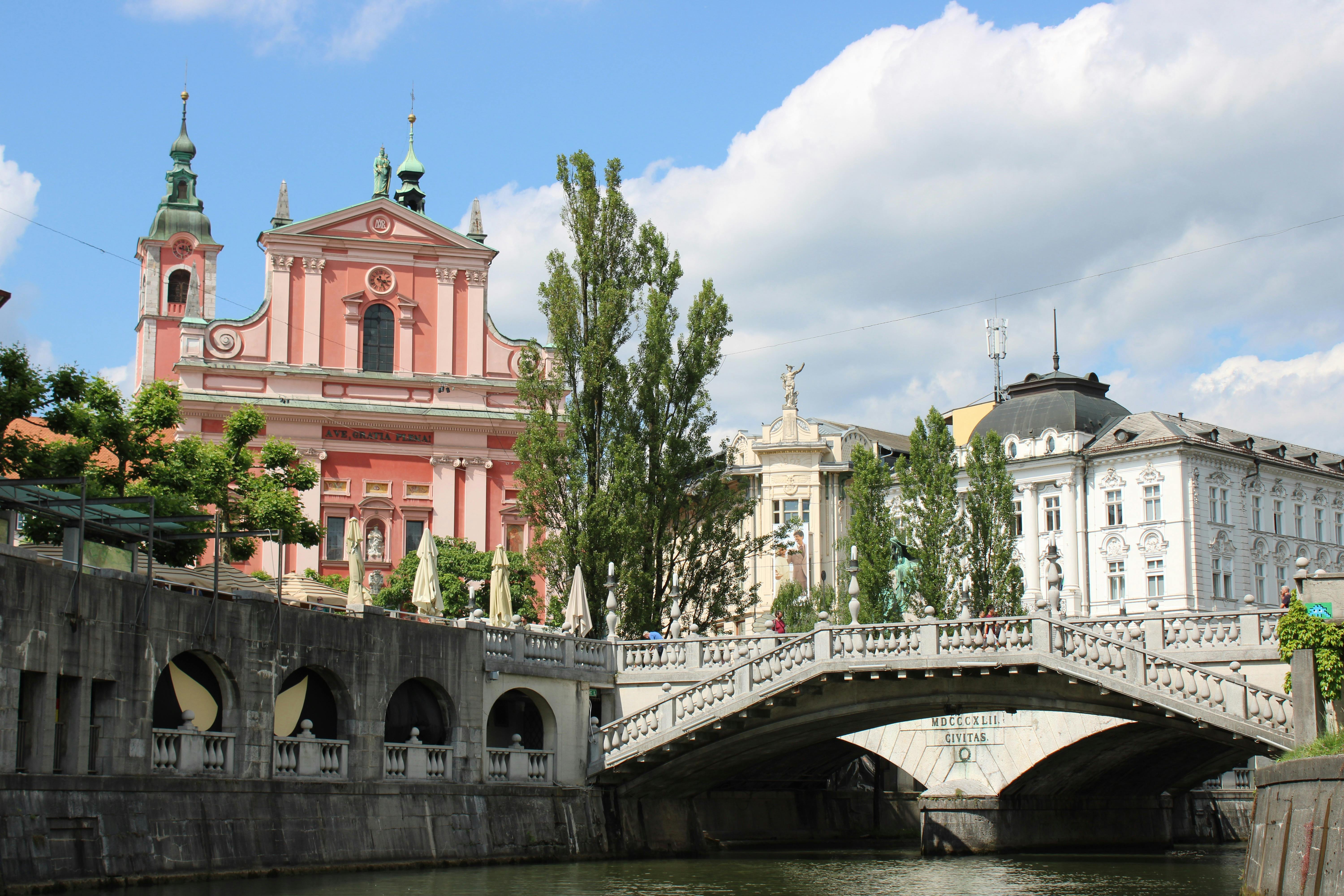 triple bridge on river in ljubljana