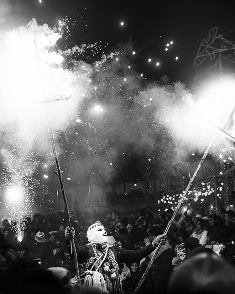 Man In Mask Giving Fireworks Display