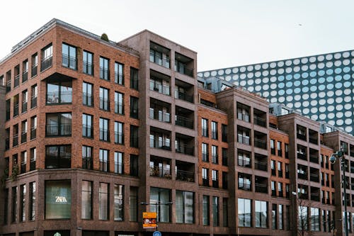 A large brown building with windows on the side