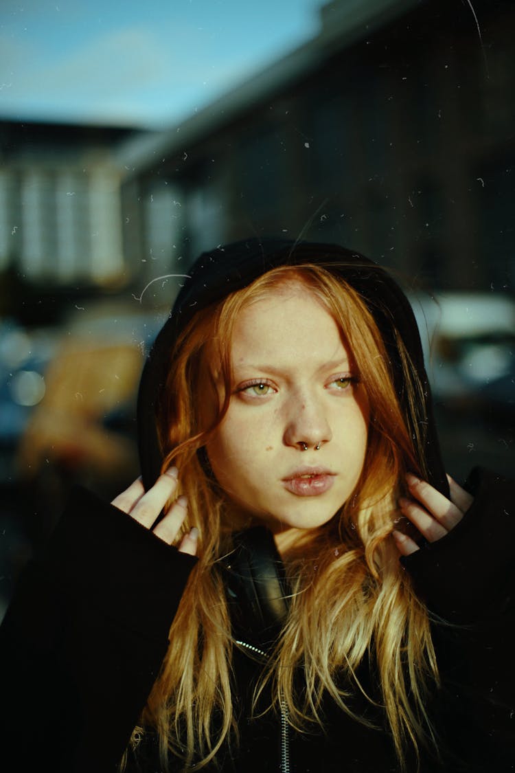 Redhead Woman With Black Hood On Head