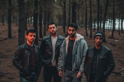 Casual Style Men in Jackets Posing in Forest