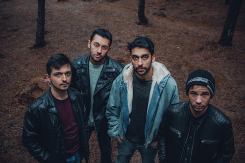 A group of men standing in the woods