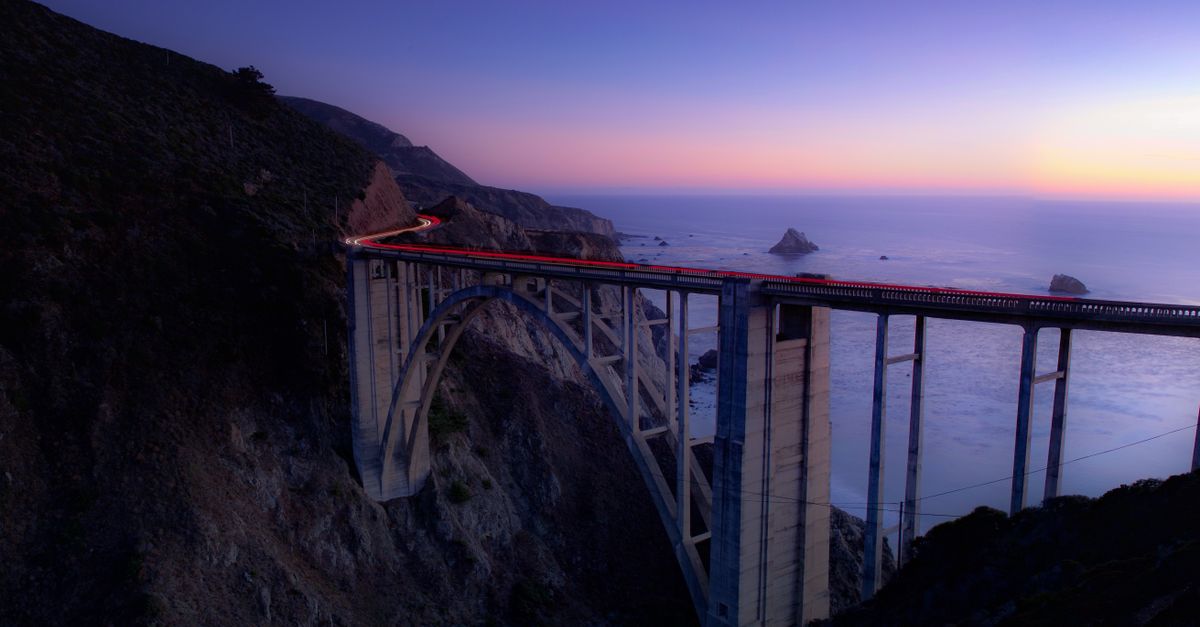 Beautiful twilight view of Bixby Creek Bridge with ocean backdrop in Big Sur, California.