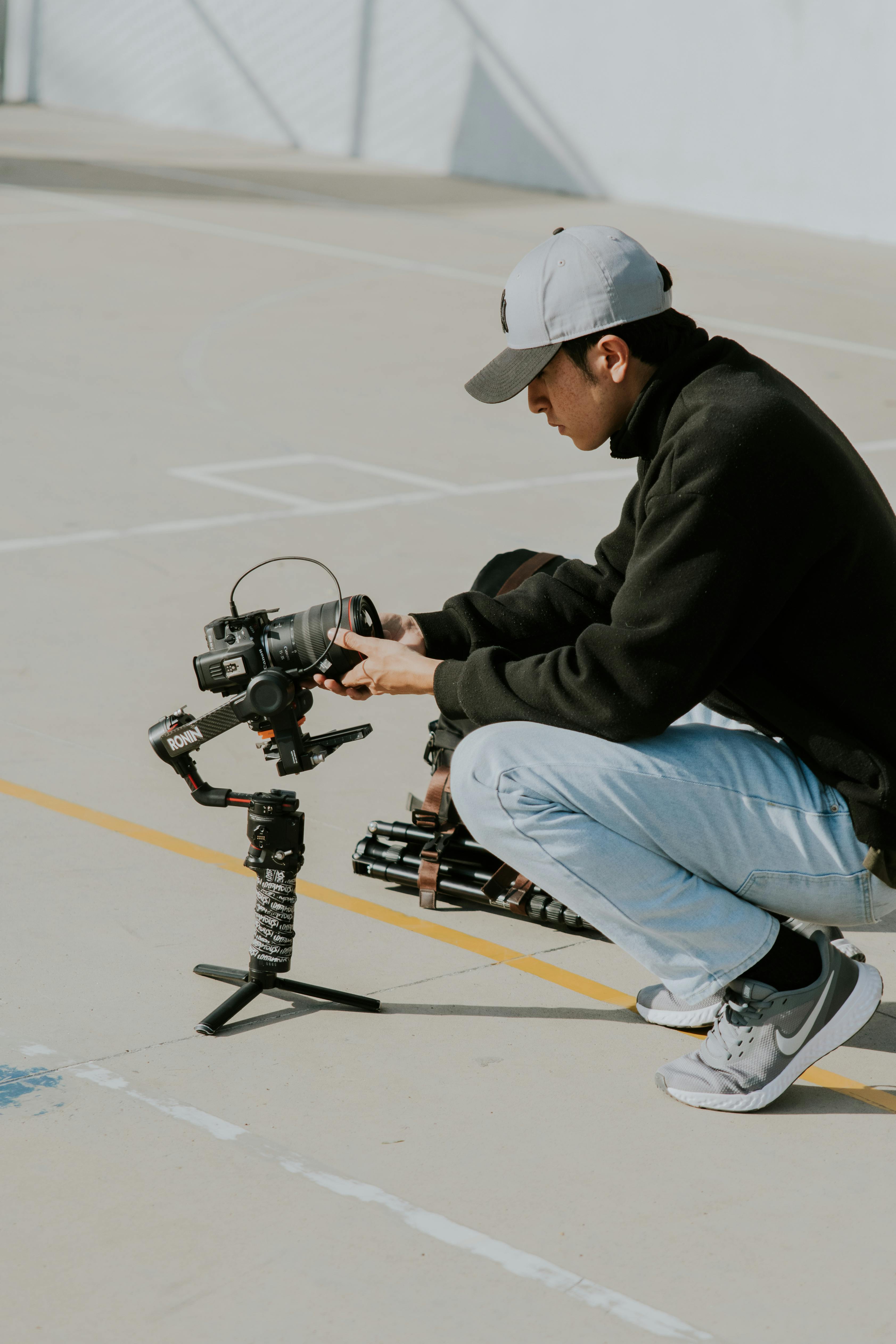 photographer squatting with camera