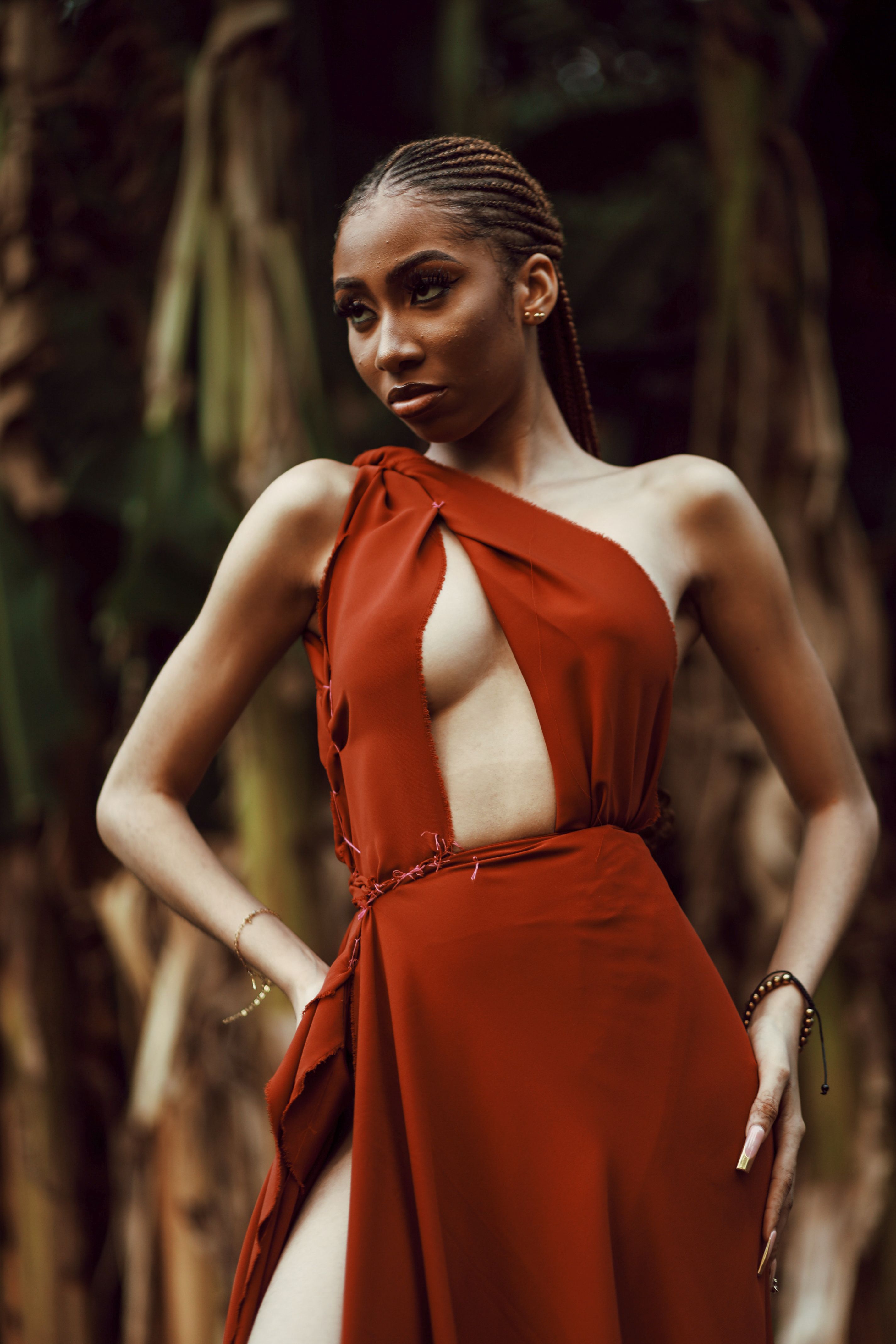 Woman in Long Dress with a Slit Standing on One Leg  Free Stock Photo