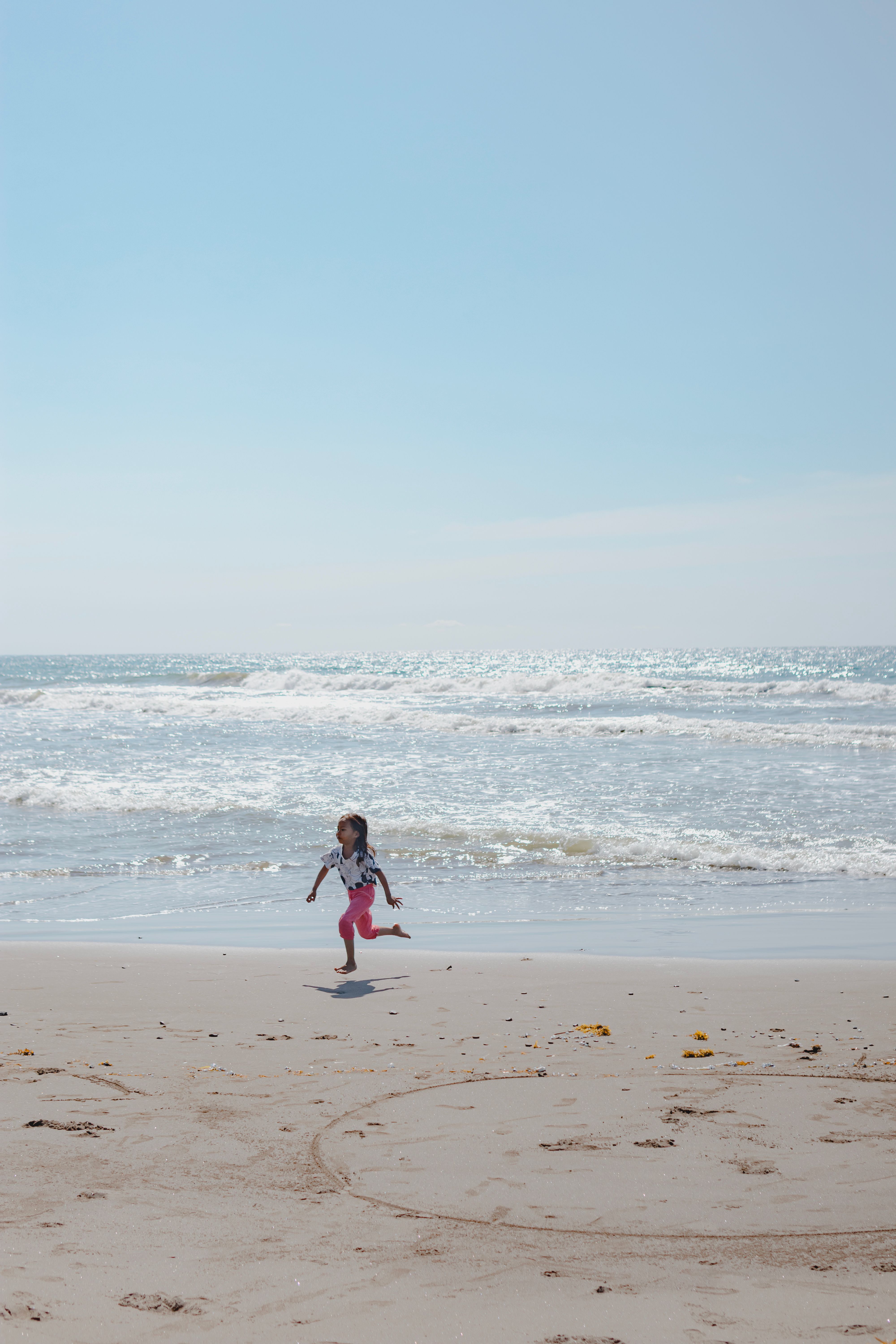 Girl Running on Beach · Free Stock Photo
